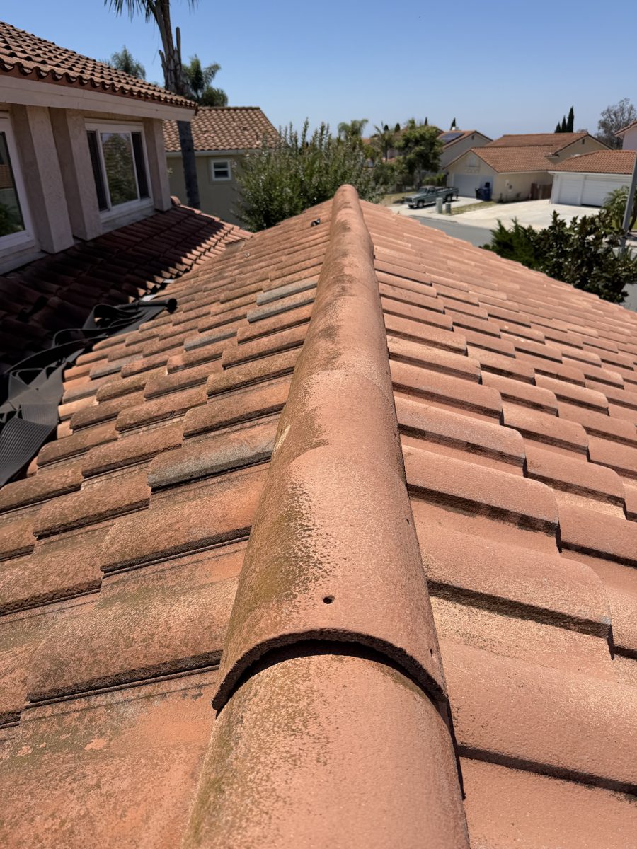 Tile roof being soft-washed